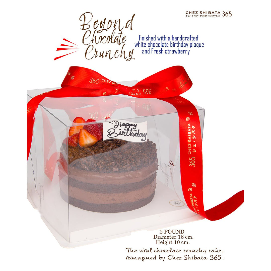 Chocolate birthday cake in clear packaging with a red ribbon, branded 'Chez Shibata 365'.