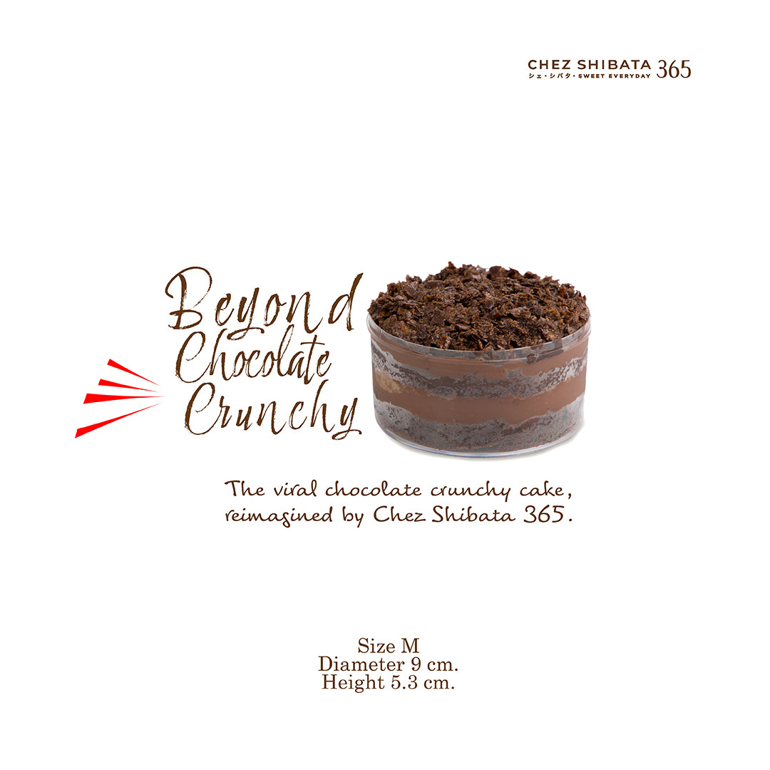 Chocolate crunchy cake in a glass container with branding and product details on a white background