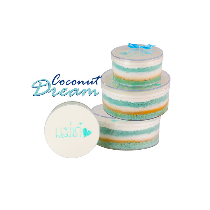 Stack of layered soap bars with a round bar on a white background, featuring 'Coconut Dream' text.