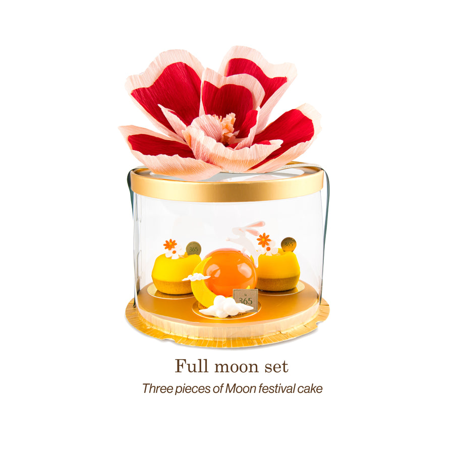 A festive “Full Moon Set” featuring three moon-themed mousse cakes in a round clear gift box, topped with a large red-and-white paper flower — from Chez Shibata 365.