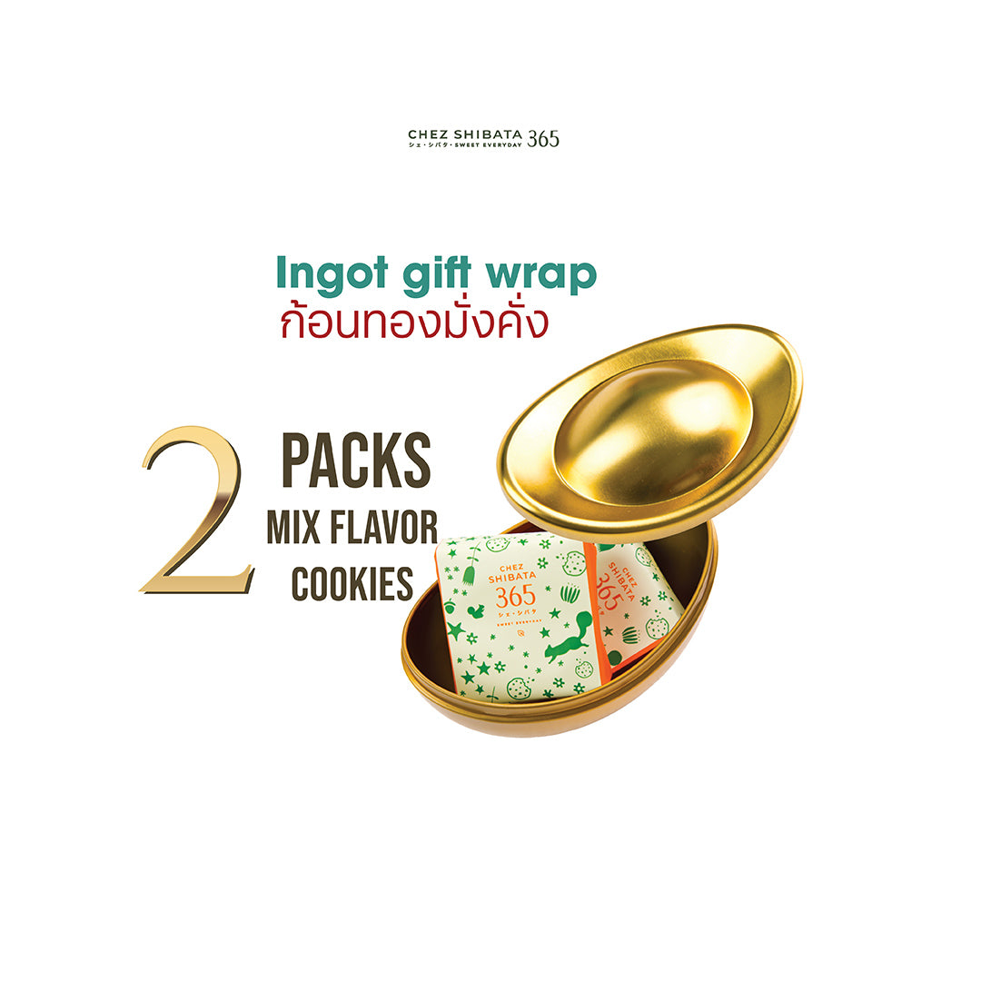 Gold ingot-shaped gift box with cookies inside on a white background